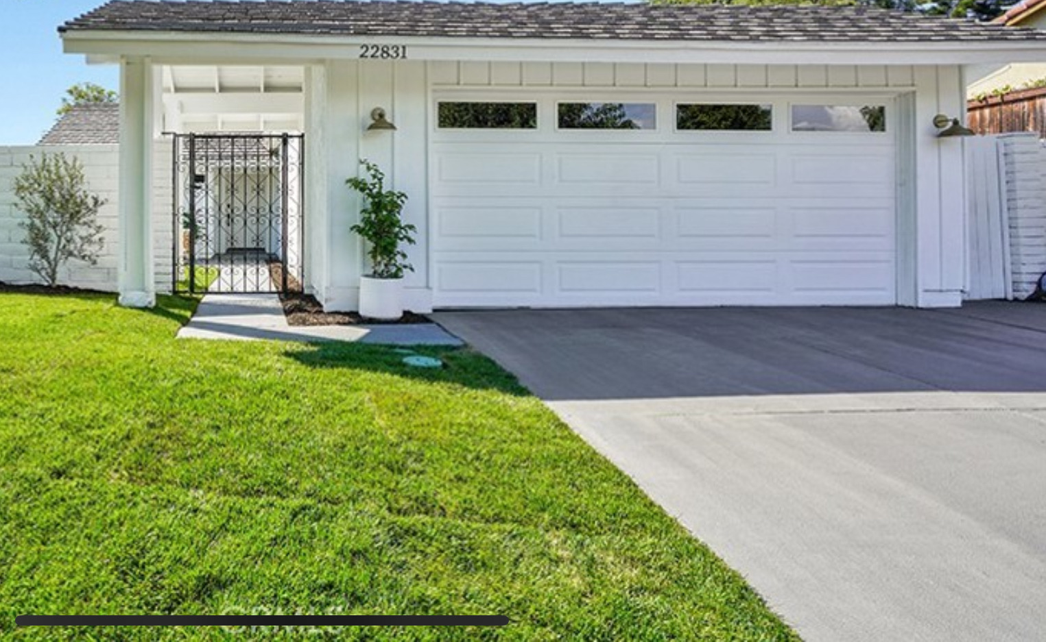 Residential concrete driveway in front of a garage